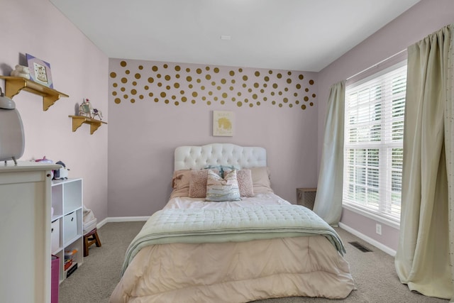 bedroom featuring carpet and multiple windows