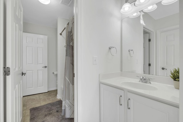 bathroom with tile patterned floors, vanity, and a shower with shower curtain