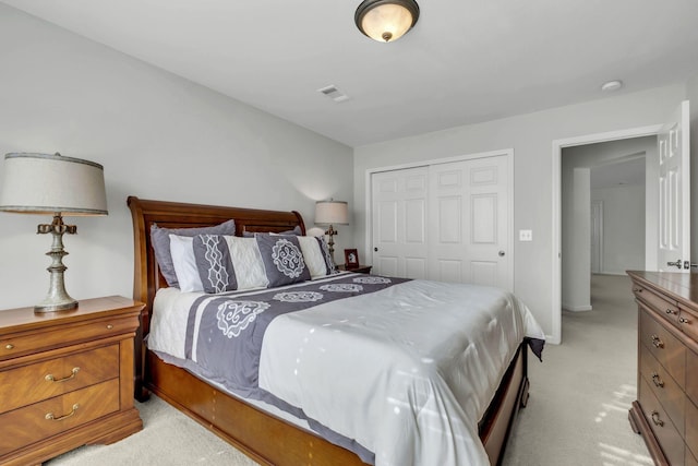 carpeted bedroom featuring a closet