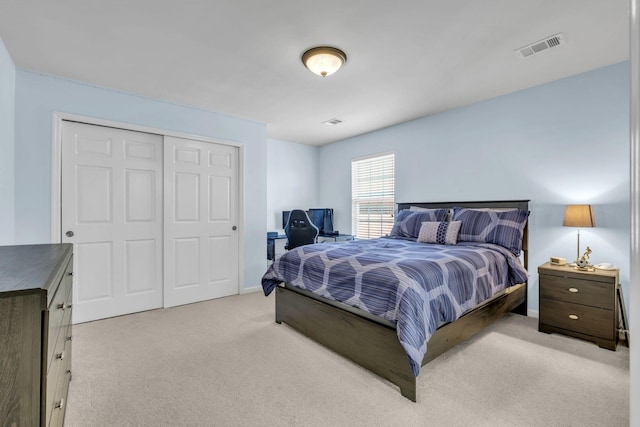 bedroom with light colored carpet and a closet