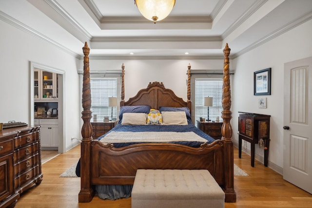 bedroom featuring crown molding and light hardwood / wood-style flooring