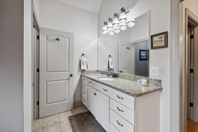 bathroom featuring tile patterned floors and vanity