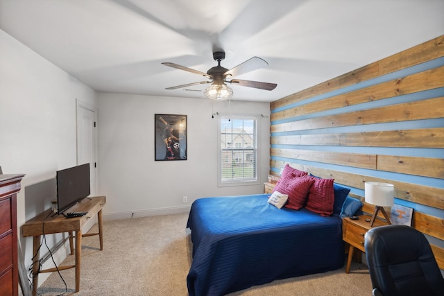 bedroom featuring ceiling fan and light carpet