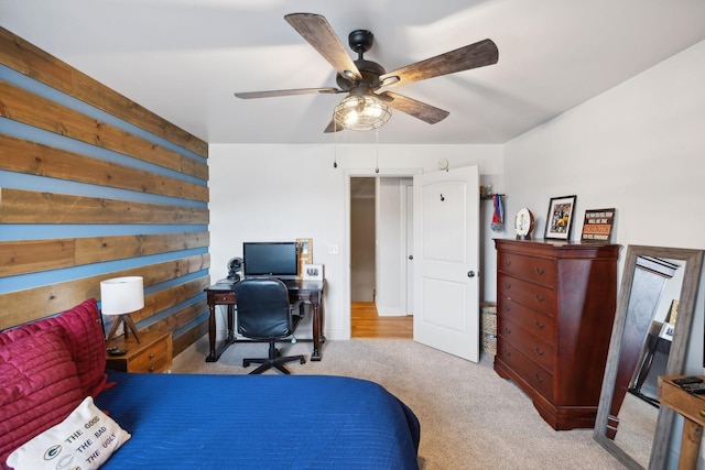 bedroom with ceiling fan and light colored carpet