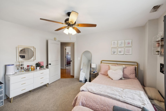 carpeted bedroom with ceiling fan