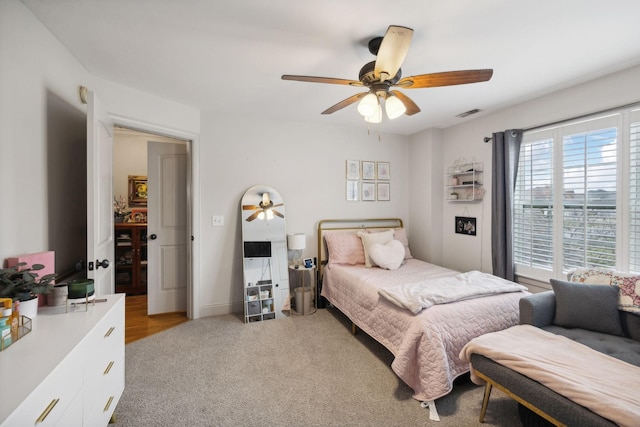 carpeted bedroom featuring ceiling fan