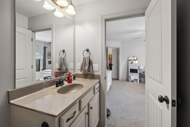 bathroom with ceiling fan and vanity