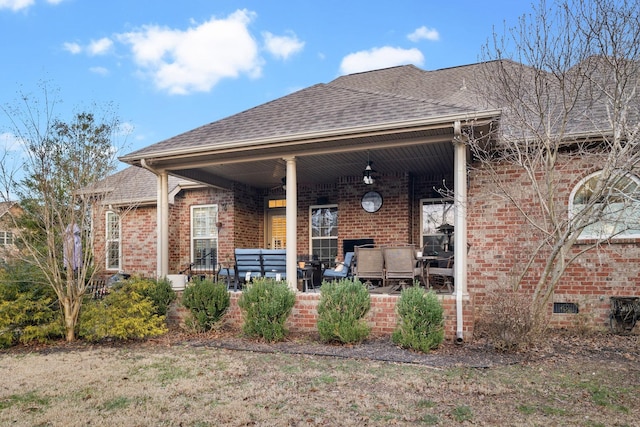 rear view of house with a porch