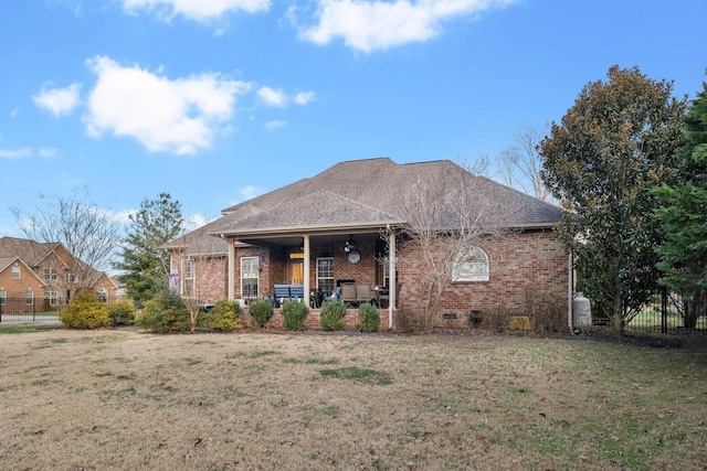 back of house with a lawn and a porch