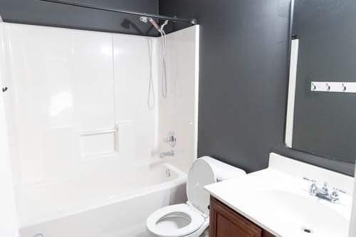 full bathroom featuring vanity, toilet, and bathing tub / shower combination