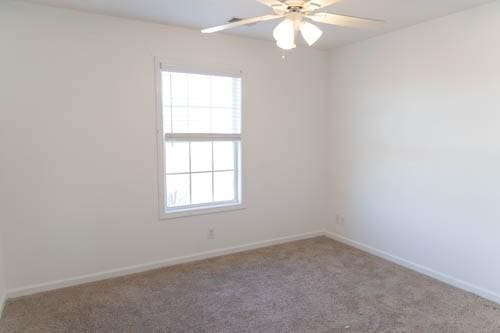 carpeted empty room with ceiling fan