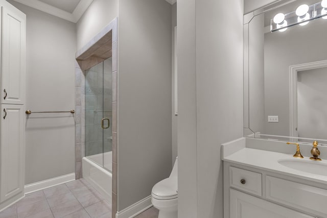 full bathroom featuring vanity, tile patterned floors, combined bath / shower with glass door, toilet, and ornamental molding