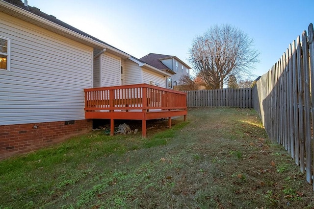 view of yard with a wooden deck