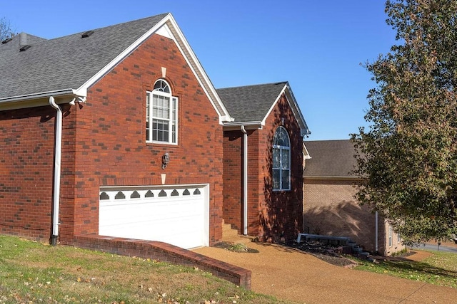 view of side of property with a garage