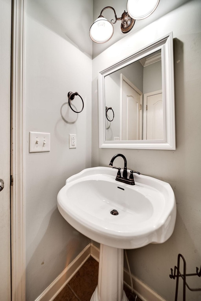 bathroom with tile patterned flooring and sink