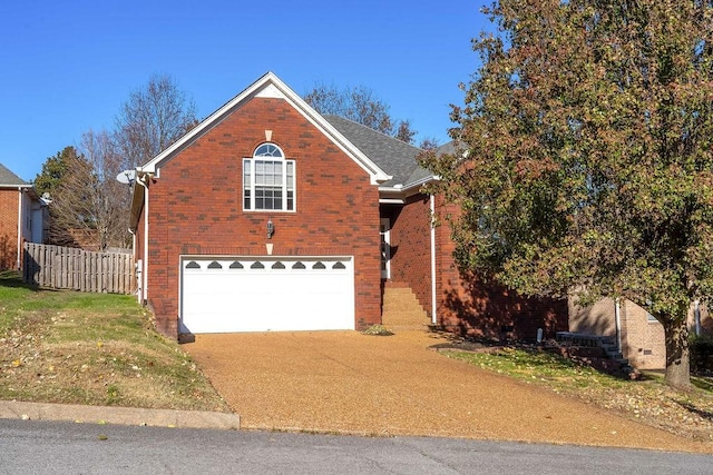 view of property with a front lawn and a garage