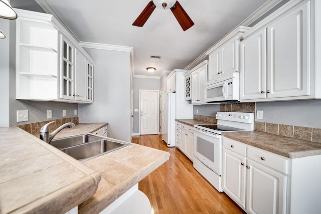 kitchen featuring white cabinetry, sink, ceiling fan, light hardwood / wood-style flooring, and white appliances