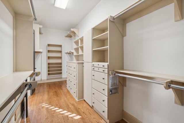 walk in closet featuring light wood-type flooring