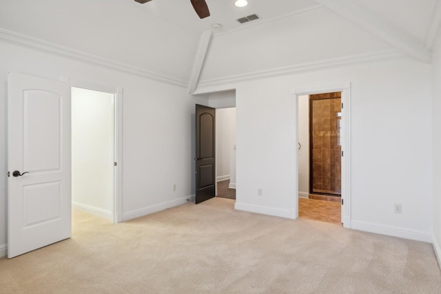 unfurnished bedroom featuring ceiling fan, light colored carpet, ornamental molding, and lofted ceiling with beams