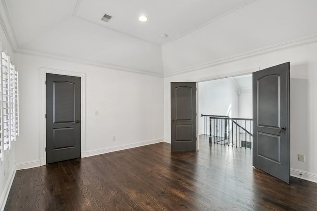 unfurnished room with ornamental molding, dark hardwood / wood-style flooring, and a raised ceiling