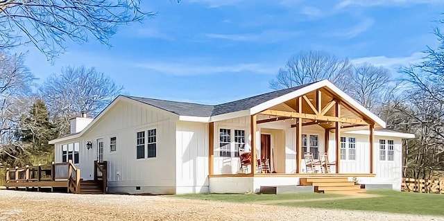 back of property featuring a wooden deck