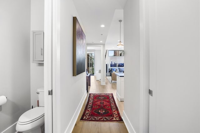 corridor with light wood-type flooring