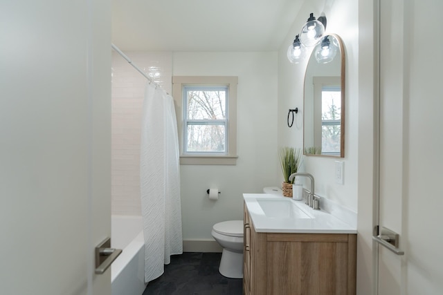 full bathroom with vanity, toilet, and shower / tub combo