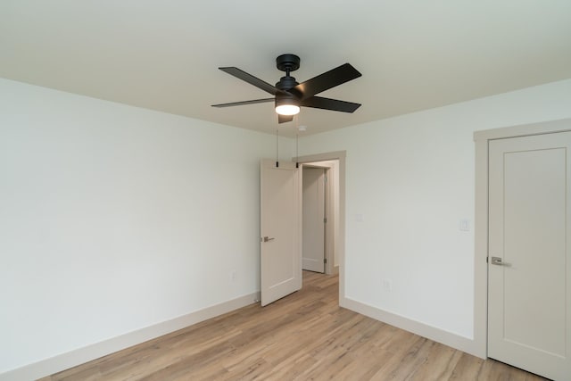 spare room with ceiling fan and light hardwood / wood-style flooring