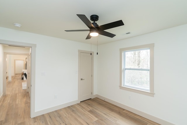 unfurnished bedroom with ceiling fan and light wood-type flooring