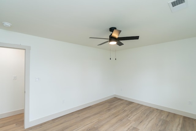 empty room featuring ceiling fan and light wood-type flooring