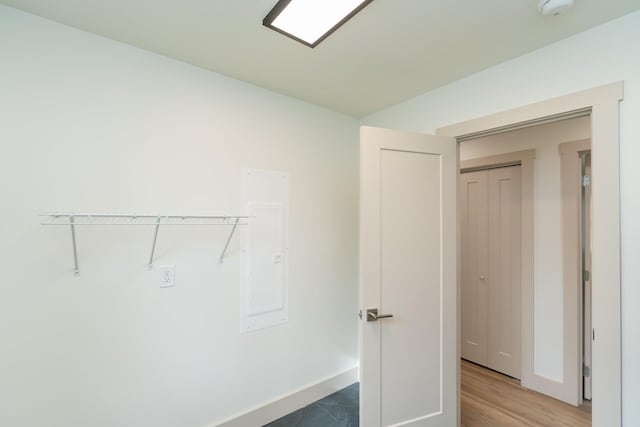 interior space with hardwood / wood-style floors and electric panel