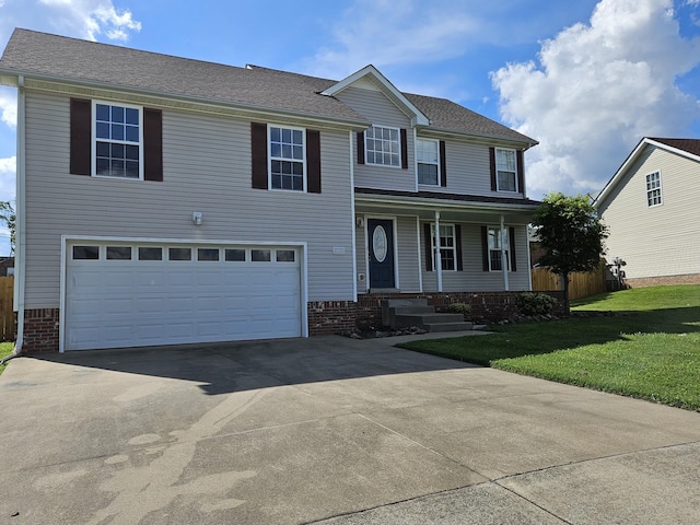 view of front facade featuring a front yard and a garage