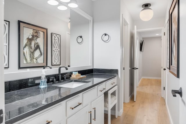 bathroom featuring hardwood / wood-style floors and vanity