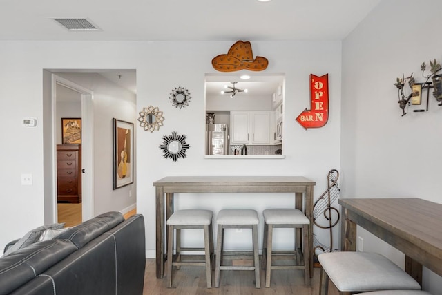 dining space featuring light hardwood / wood-style floors