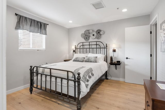 bedroom featuring light hardwood / wood-style floors