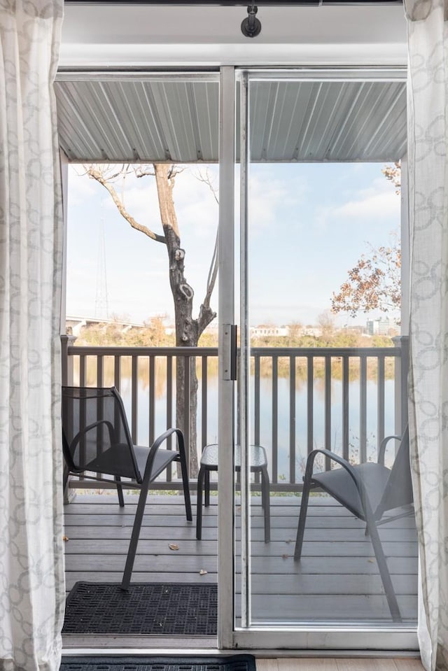 wooden deck featuring a water view