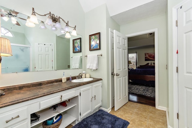 bathroom featuring tile patterned floors, vanity, and ceiling fan