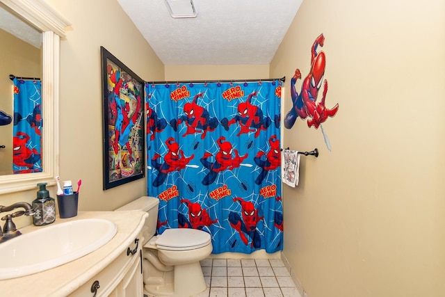 bathroom with a shower with curtain, tile patterned floors, a textured ceiling, toilet, and vanity