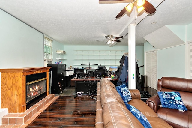 office area with ceiling fan and a textured ceiling