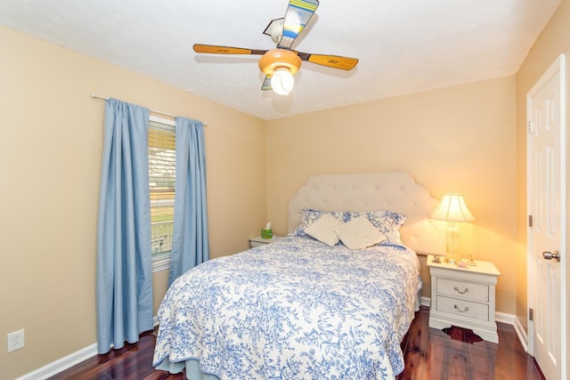 bedroom featuring ceiling fan and dark hardwood / wood-style flooring