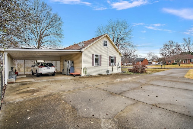 view of side of home featuring a carport