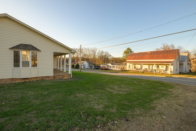 view of yard featuring covered porch