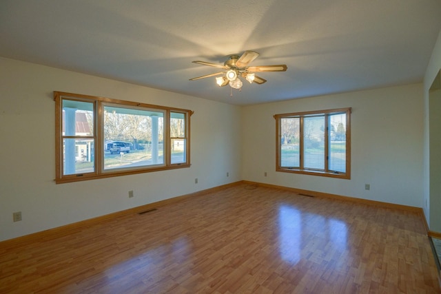 unfurnished room with ceiling fan and light hardwood / wood-style flooring