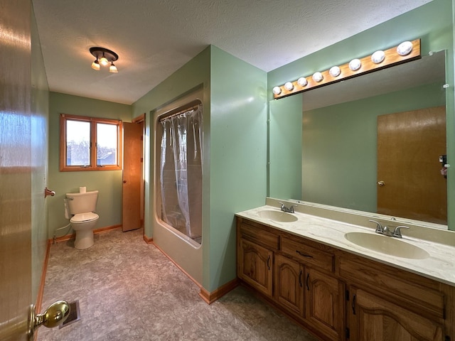 full bathroom with shower / bath combo, vanity, a textured ceiling, and toilet