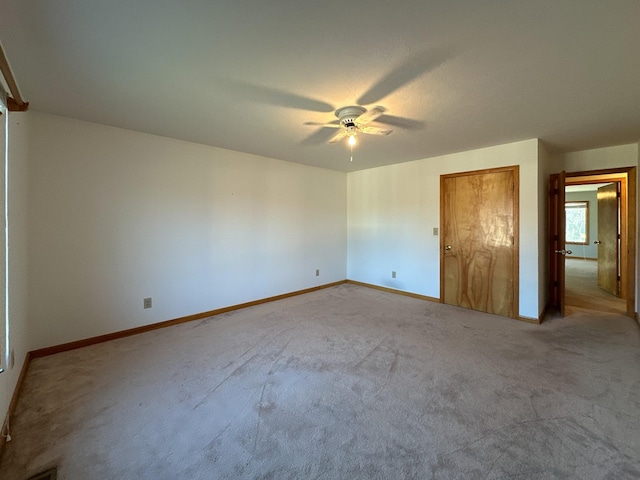 unfurnished bedroom with carpet and ceiling fan