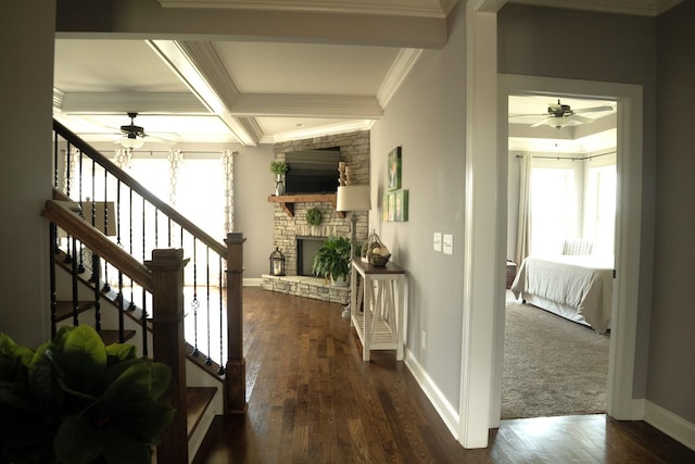 hall featuring beam ceiling, dark hardwood / wood-style flooring, crown molding, and coffered ceiling