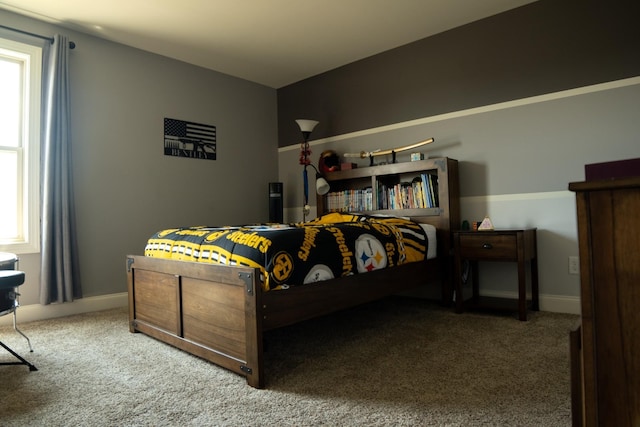 bedroom featuring carpet floors and multiple windows