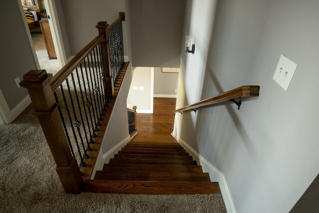 stairs with hardwood / wood-style flooring