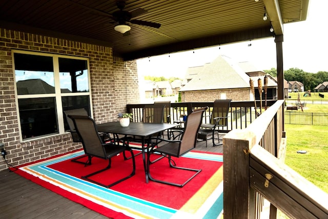 wooden deck featuring ceiling fan