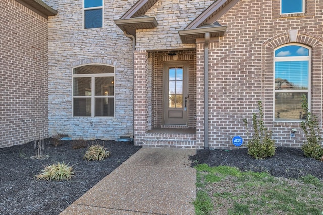 view of exterior entry featuring crawl space